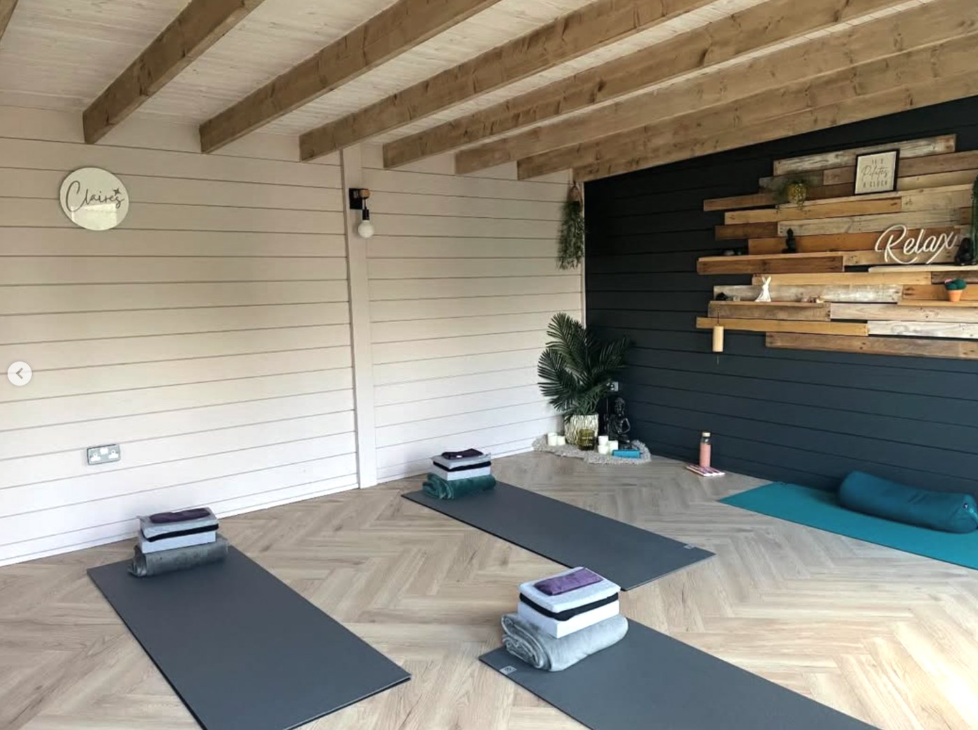 Pilates mats and blocks arranged in Claire’s studio