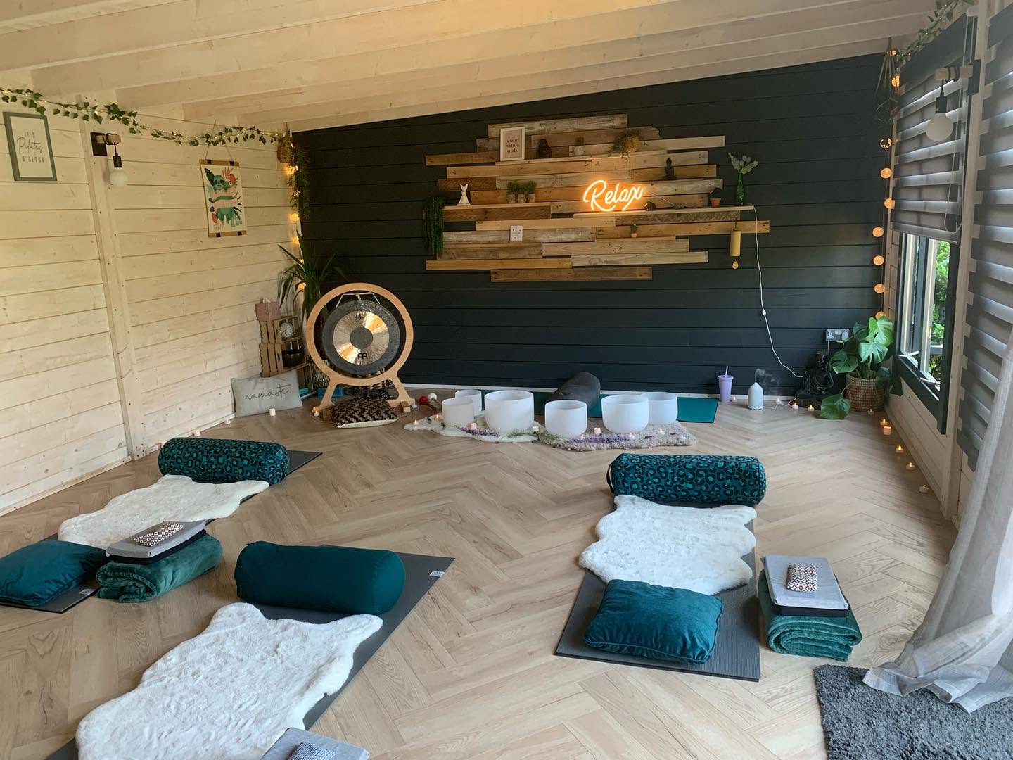 Claire’s Chelmsford studio with mats, cushions, crystal singing bowls and a gong